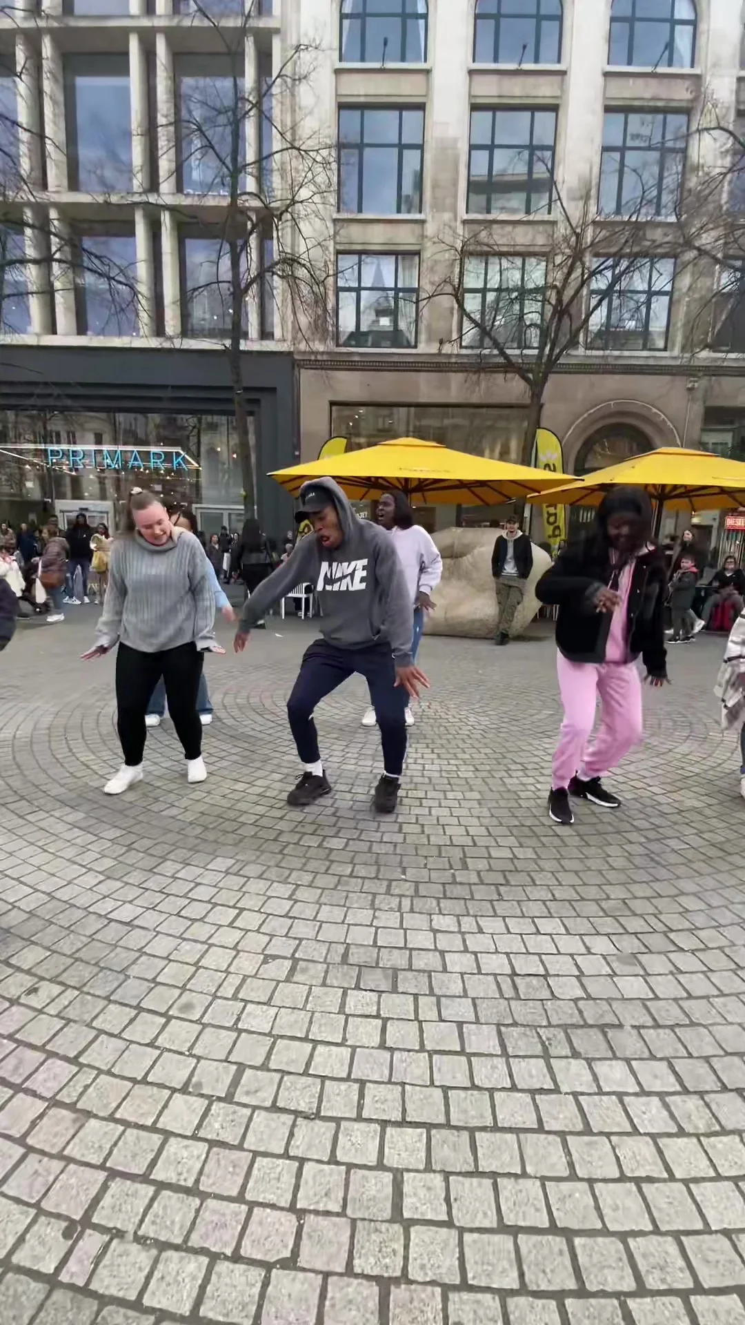 Members dancing on the Meir shopping street while passers-by watch